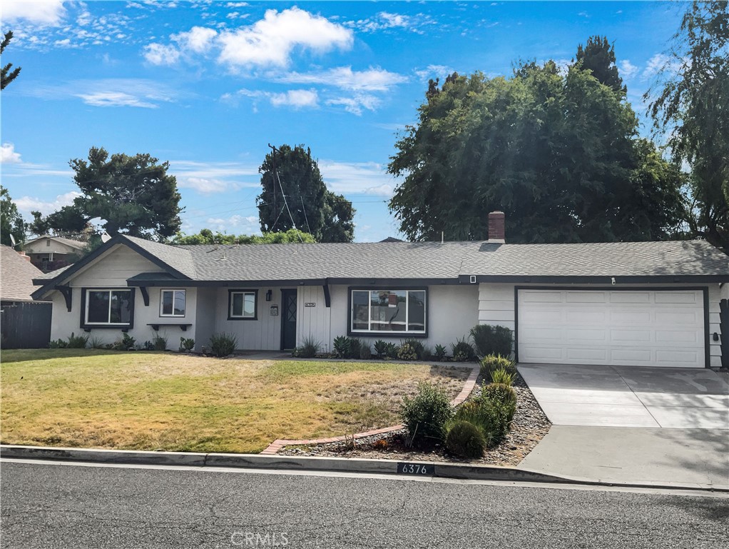 6376 Westview Drive Riverside, CA 92506 - Photo 9 of 23 a front view of a house with a yard