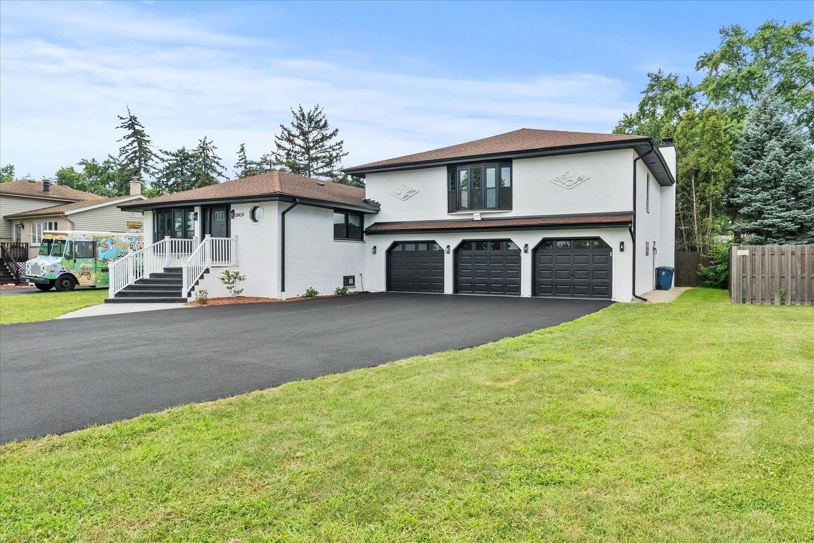 a view of a house with a yard and plants