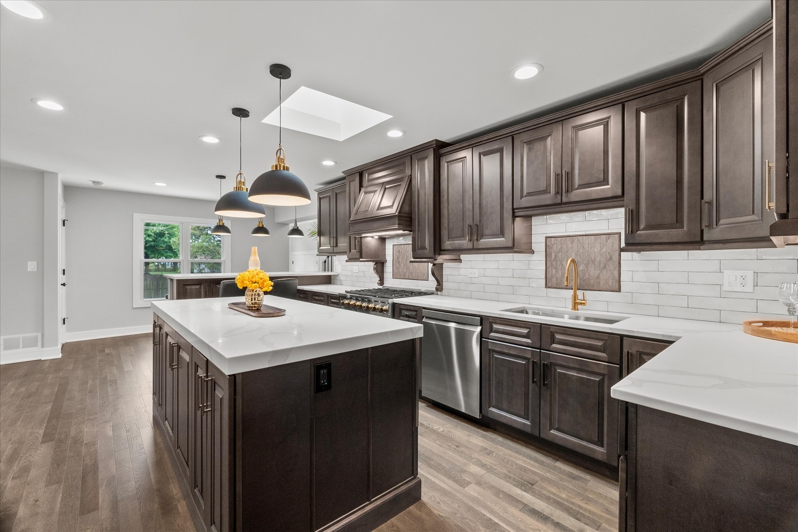 S424 Cadwell Avenue Elmhurst, IL 60126 - Photo 3 of 29 a kitchen with stainless steel appliances granite countertop a sink stove and wooden cabinets