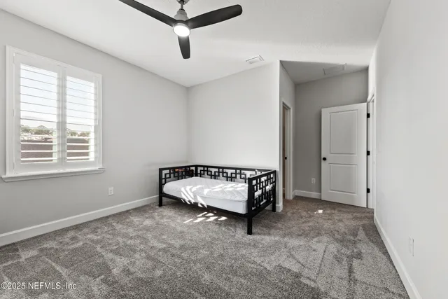 a room with a bed and window