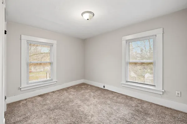 an empty room with windows