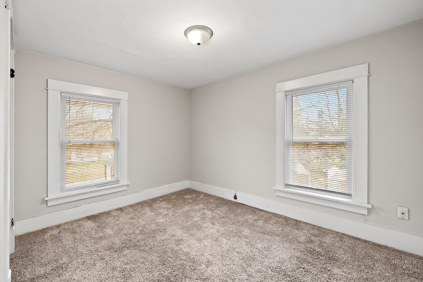415 Dean Street, Unit 2 Woodstock, IL 60098 - Photo 14 of 21 an empty room with windows