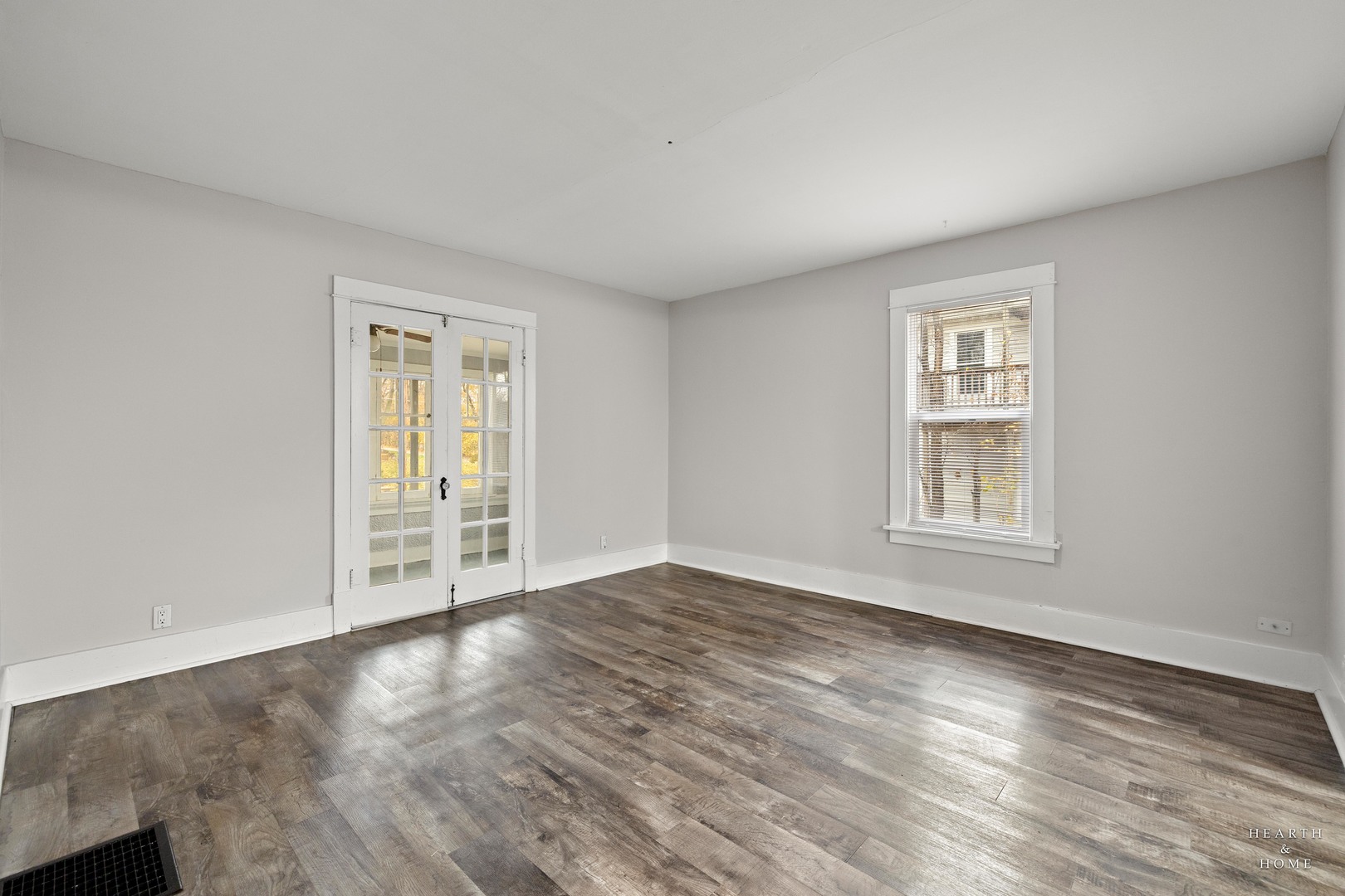 415 Dean Street, Unit 2 Woodstock, IL 60098 - Photo 17 of 21 an empty room with windows