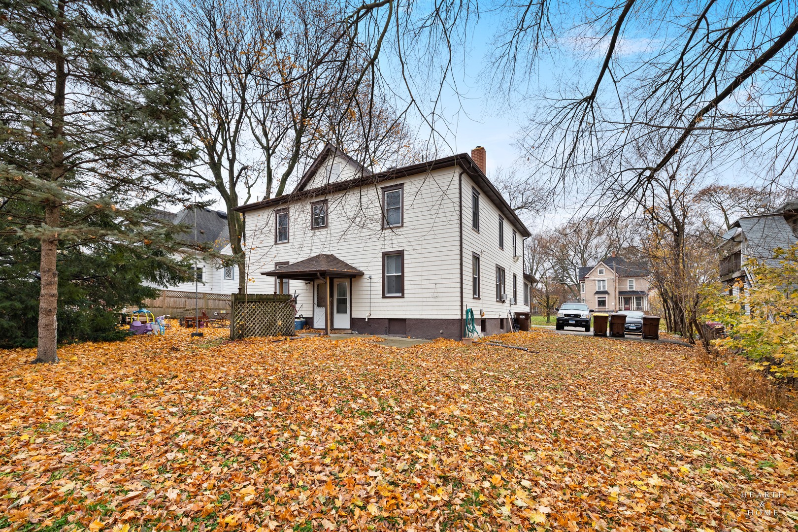 415 Dean Street, Unit 2 Woodstock, IL 60098 - Photo 21 of 21 a front view of a house with a large tree
