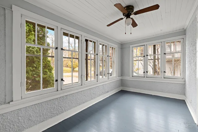 a view of room with window and ceiling fan