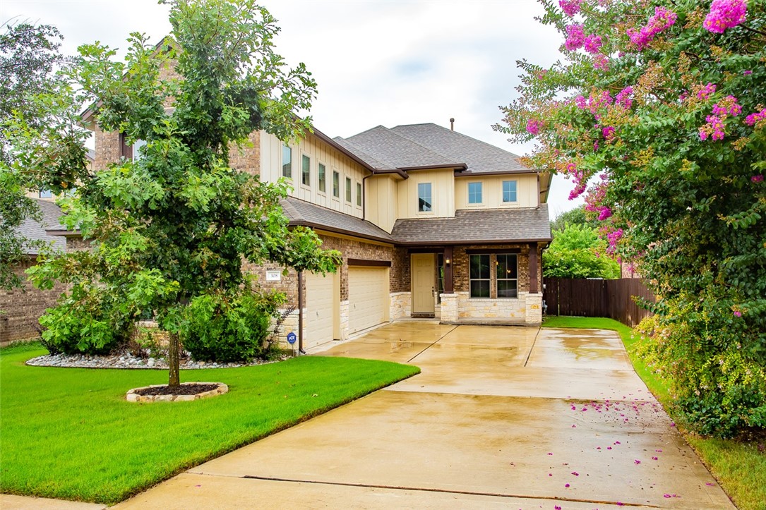 308 Entrada Way Round Rock, TX 78681 - Photo 1 of 1 a front view of a house with garden