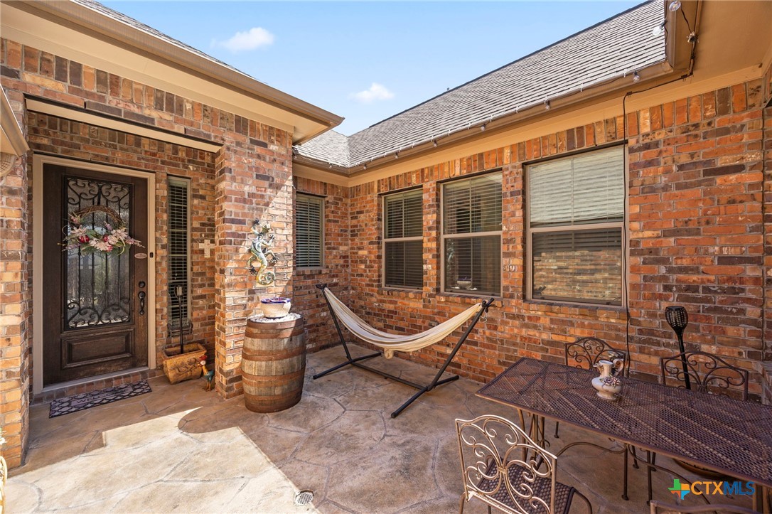 1205 Winding Way Drive Georgetown, TX 78628 - Photo 4 of 39 The courtyard leads to the front door, its the perfect space to sit outside and enjoy your morning cofffee.