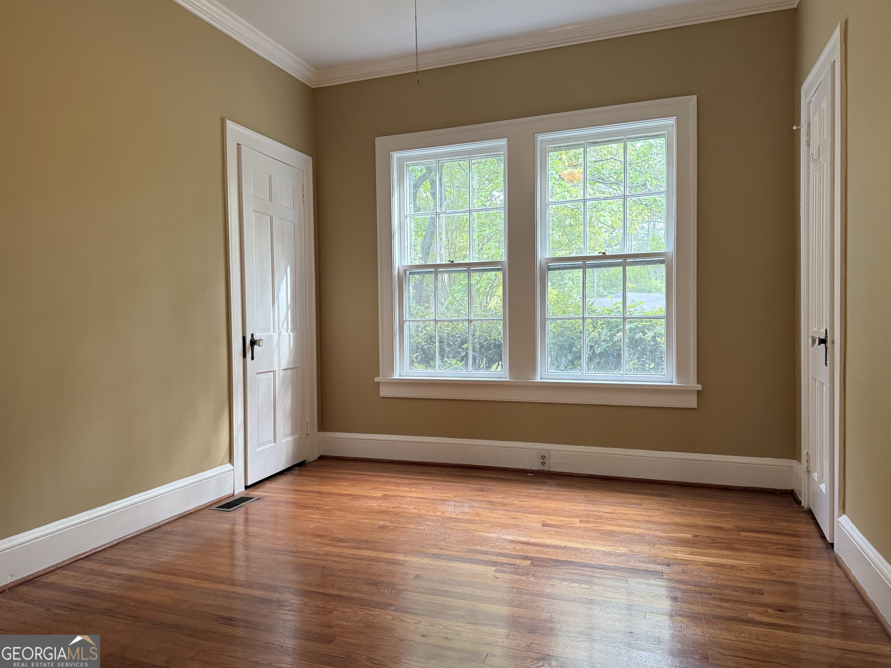 19 Berckmans Lane Southwest Rome, GA 30165 - Photo 17 of 32 an empty room with wooden floor and windows