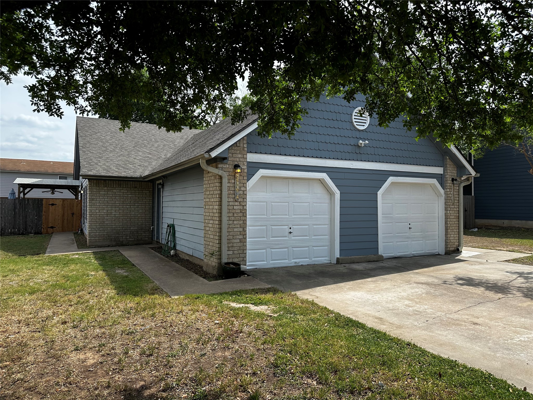 8809 Cainwood Lane Austin, TX 78729 - Photo 2 of 27 a view of a backyard