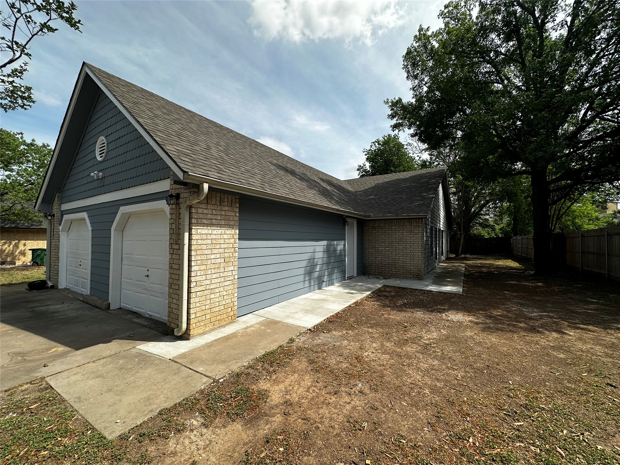 8809 Cainwood Lane Austin, TX 78729 - Photo 5 of 27 a house with a outdoor space