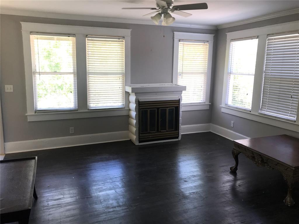 1952 Morrill Street, Unit B Sarasota, FL 34236 - Photo 4 of 12 a view of an empty room with wooden floor and a window