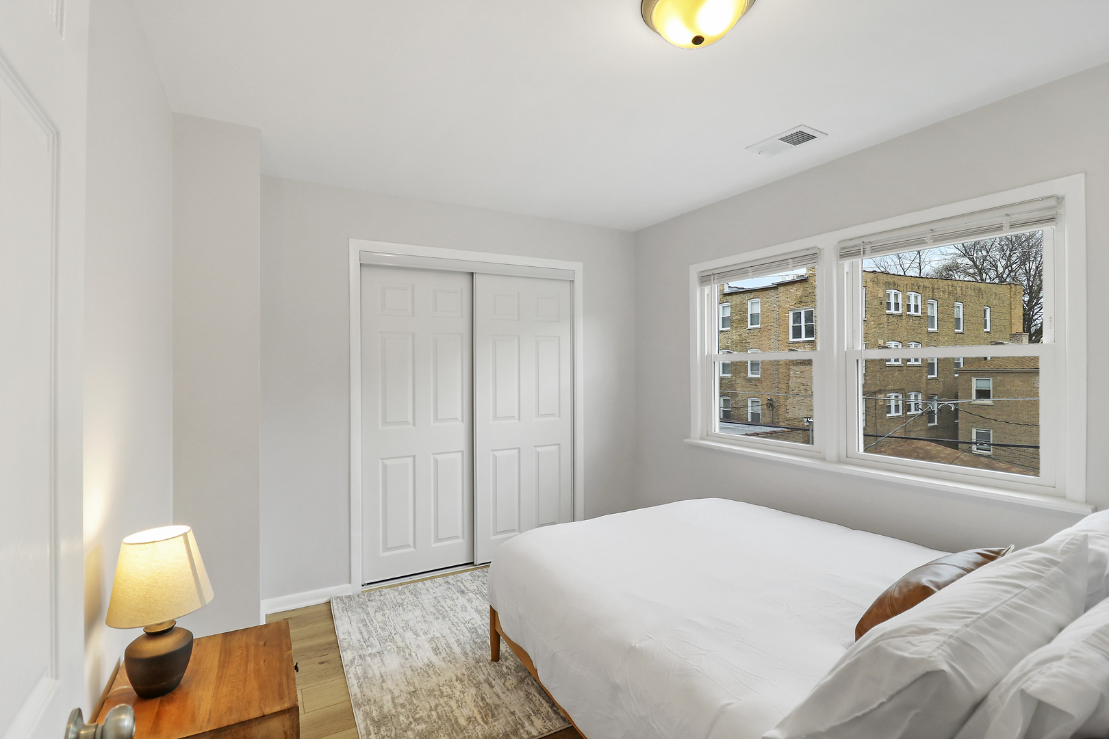 135 Custer Avenue, Unit 3 Evanston, IL 60202 - Photo 16 of 18 a bedroom with a bed and a window