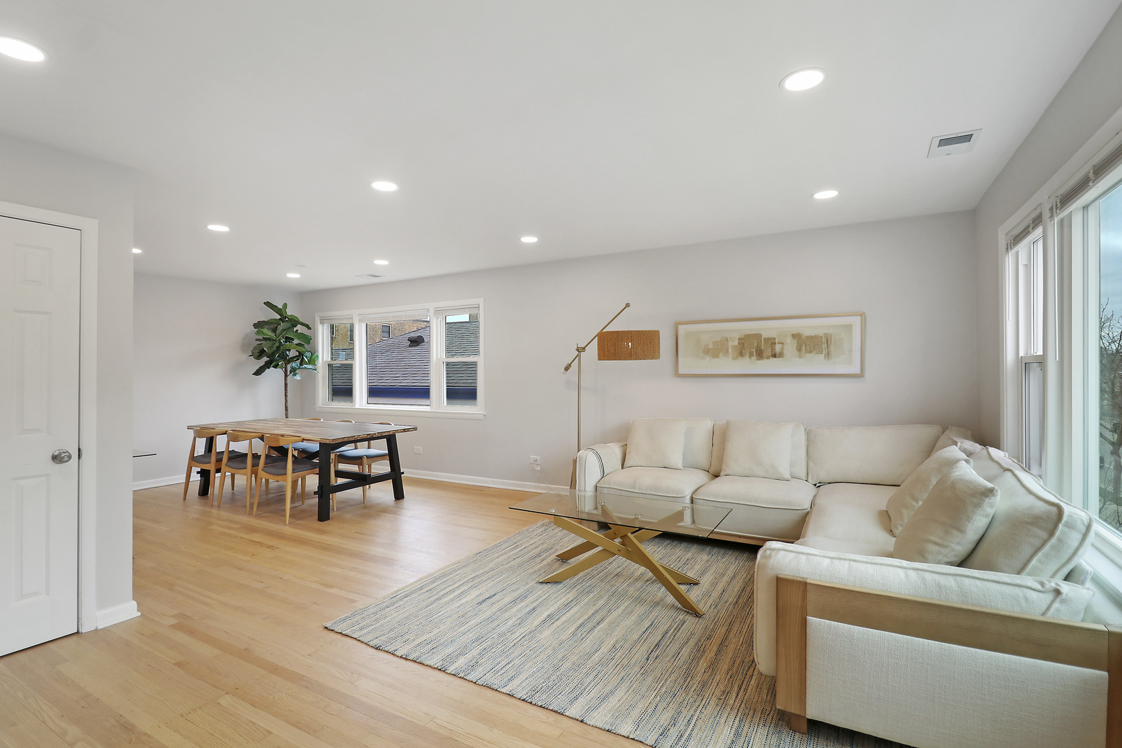 135 Custer Avenue, Unit 3 Evanston, IL 60202 - Photo 6 of 18 a living room with furniture and a table