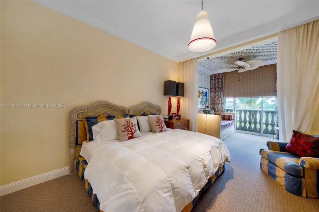 a bedroom with a bed and lamp