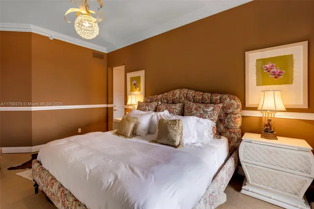 a bedroom with a bed gym equipment and large windows