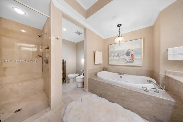 a view of a dining room with furniture and a chandelier