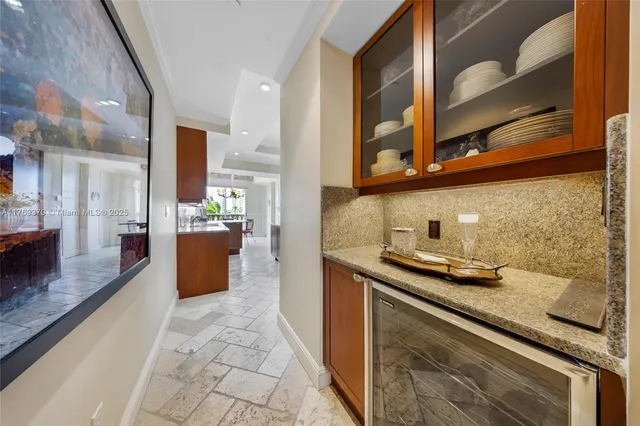 a view of cabinets a sink and a window in a room