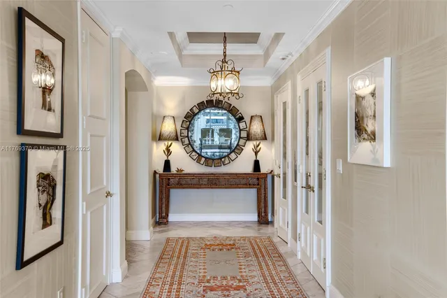 a living room with furniture a rug and white walls