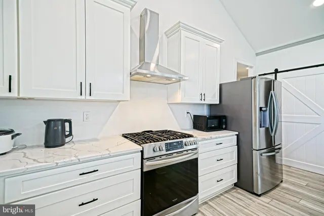 a kitchen with appliances and cabinets