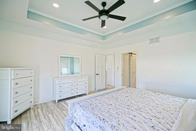 a bedroom with a bed and a dresser