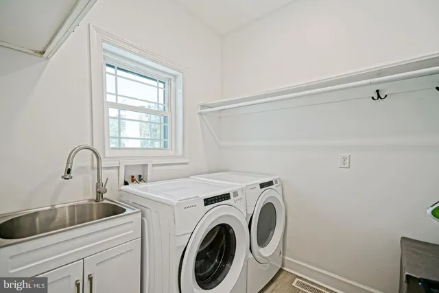 a utility room with dryer and washer