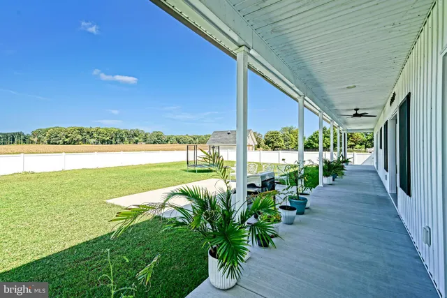 a view of a garden with an ocean view