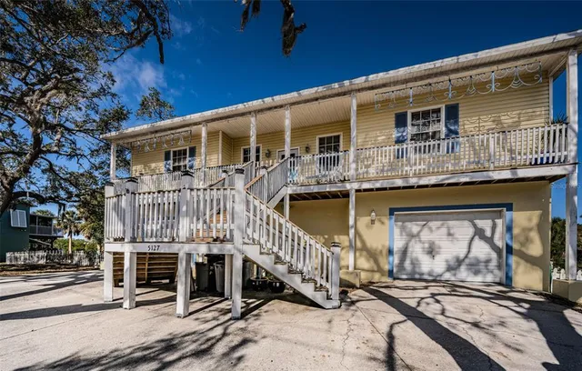 a front view of a house with barbeque area