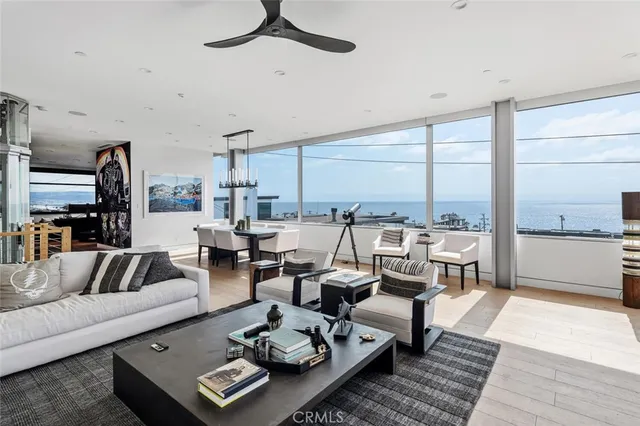 a living room with lots of furniture and a large window