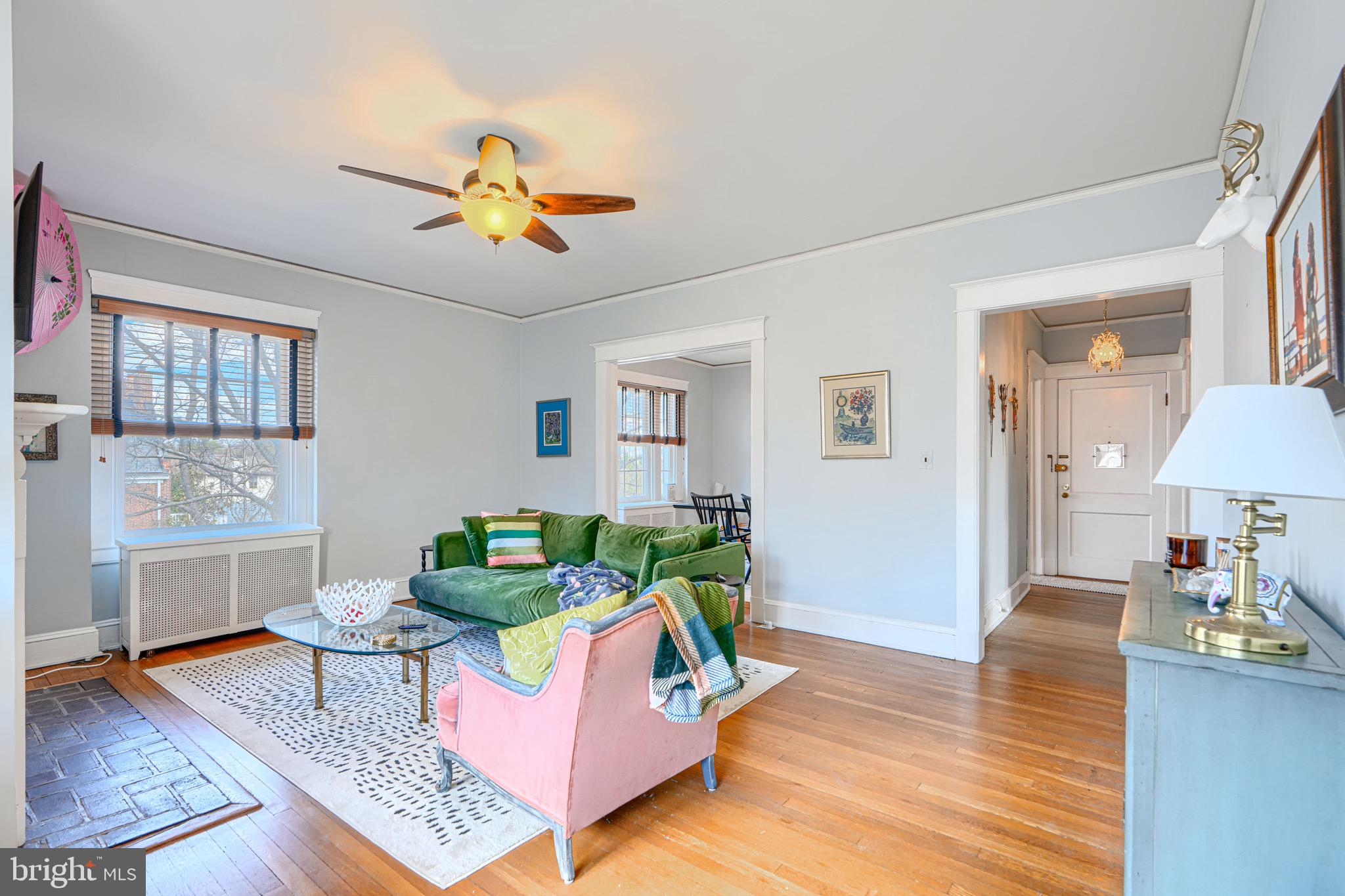 607 Somerset Road, Unit 5 Baltimore, MD 21210 - Photo 12 of 38 a living room with furniture and a chandelier