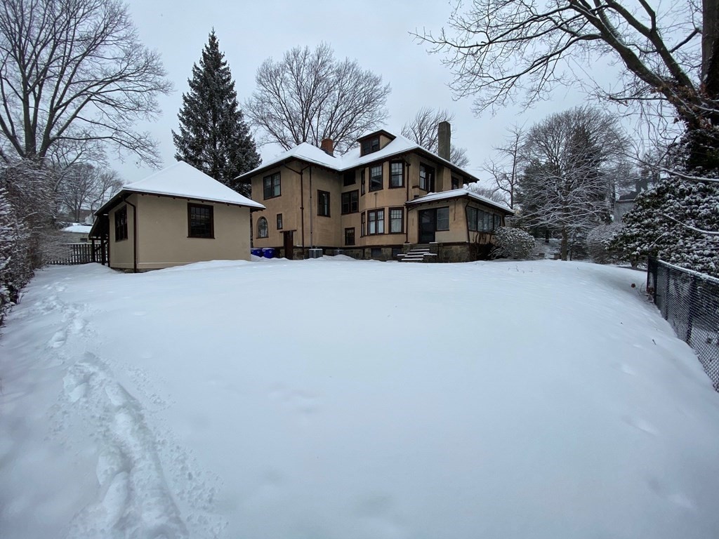 14 Orchard Road Brookline, MA 02445 - Photo 6 of 6 a front view of house with yard covered in snow