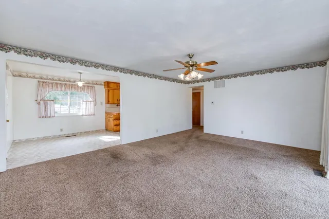 a view of an empty room with a window