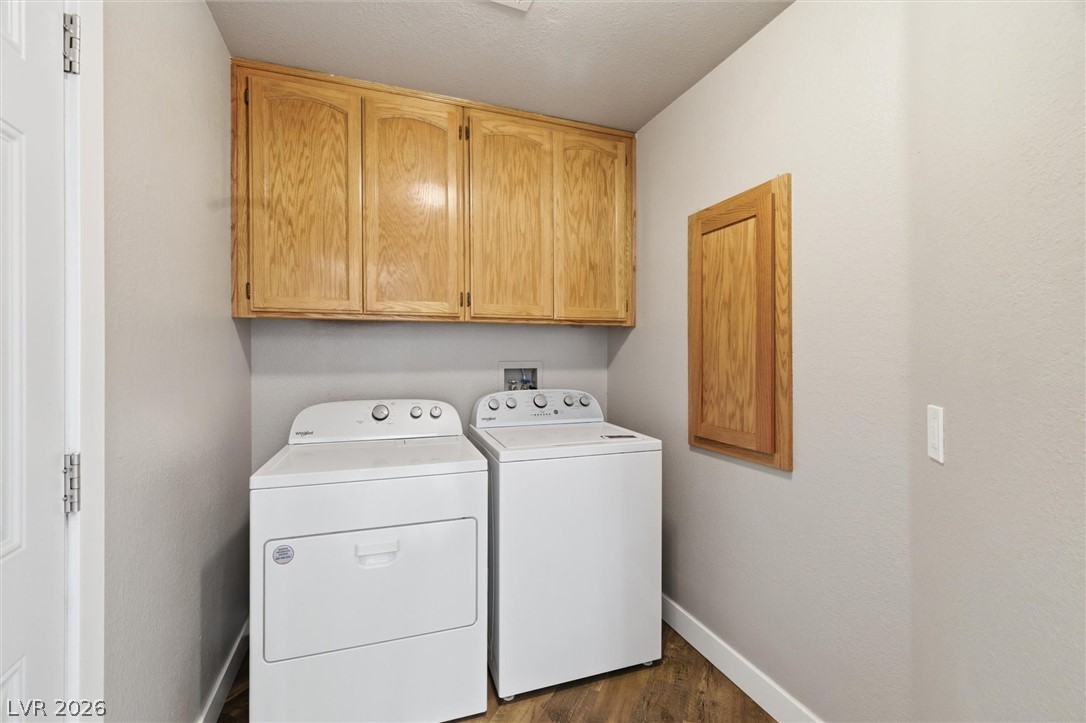 2780 West Simkins Road Pahrump, NV 89060 - Photo 20 of 40 Ample cabinetry provides smart storage in this functional and well-appointed laundry space.