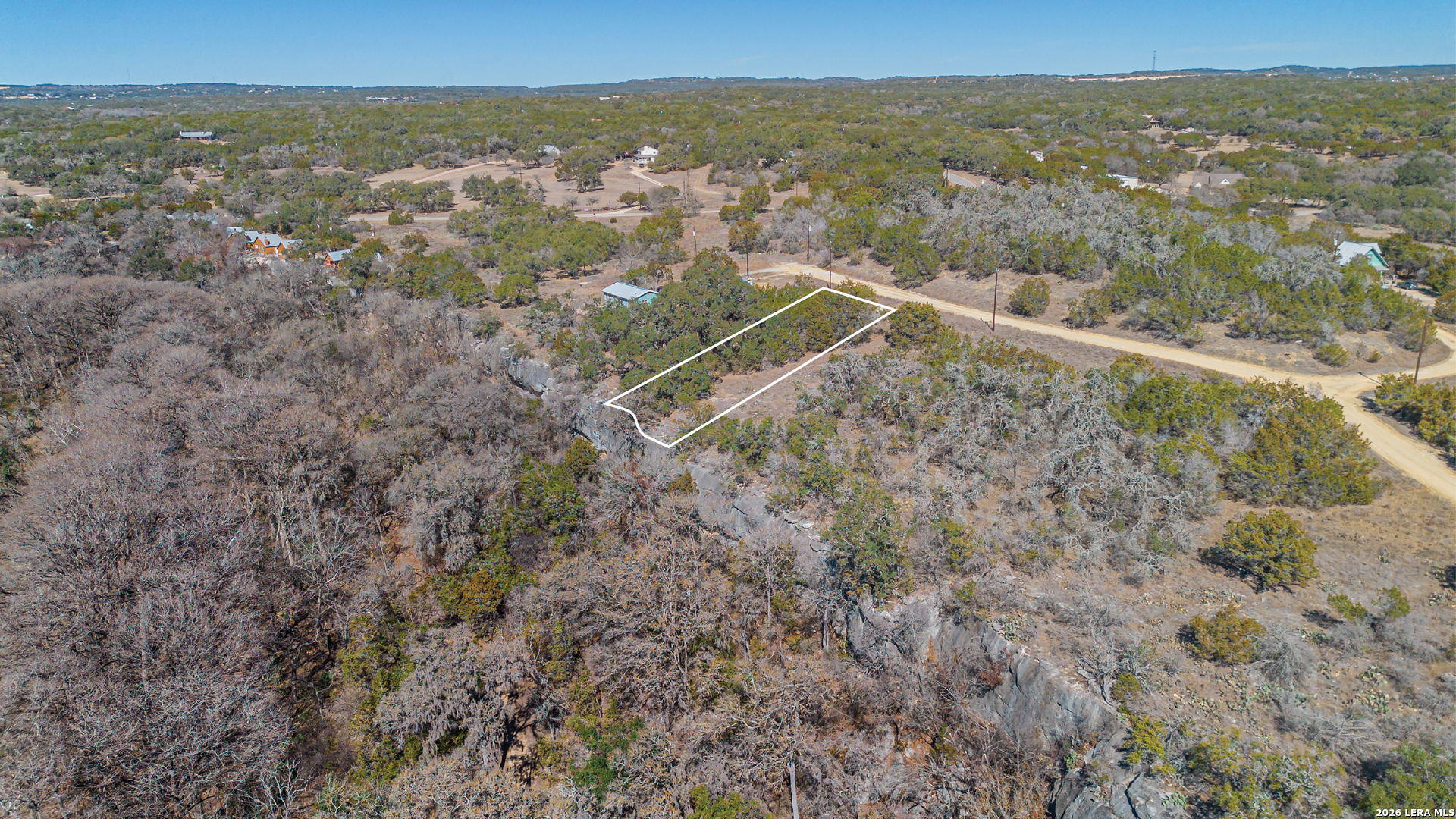 1048 Blue Bonnet Hl Drive Spring Branch, TX 78070 - Photo 1 of 1 a view of a city with mountains in the background
