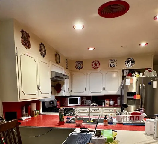 a living room with lots of furniture and appliances