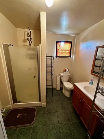 a view of a bathroom with a sink and a mirror