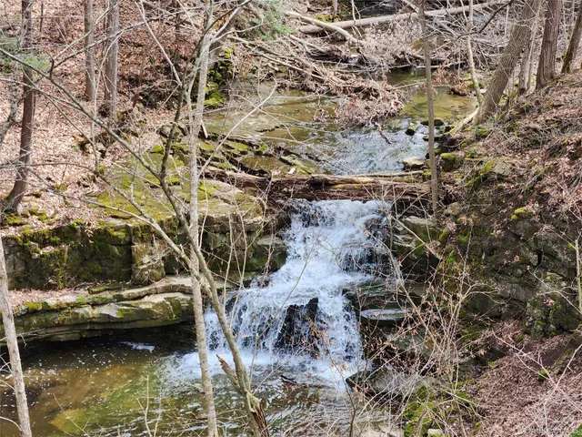 a view of outdoor space with wooden fence
