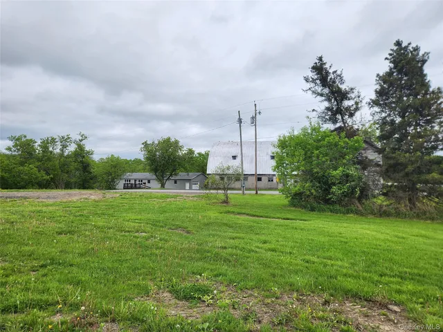 a house view with a sitting space and garden