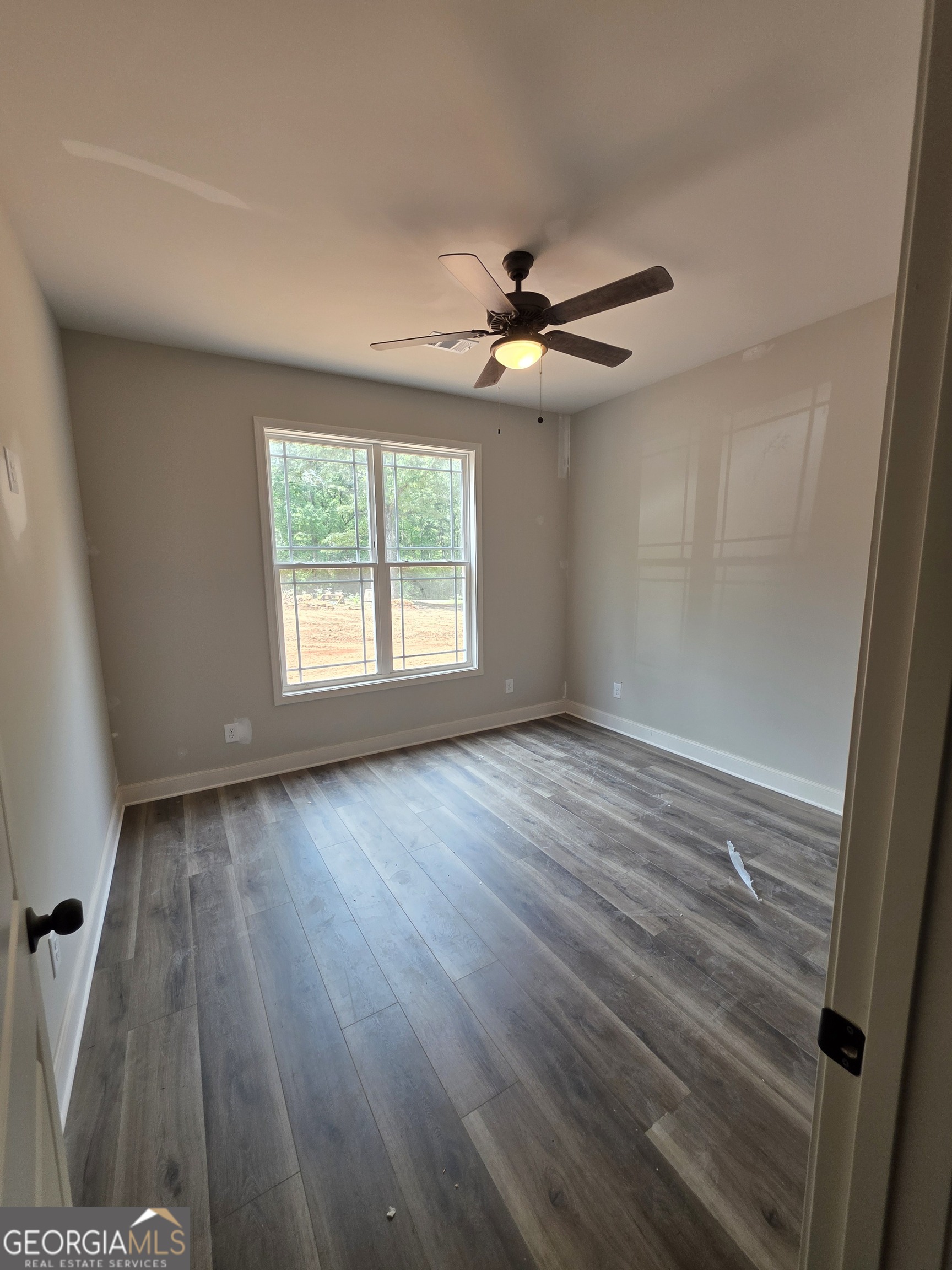 215 Panola Road Jackson, GA 30233 - Photo 12 of 16 wooden floor in an empty room with a window