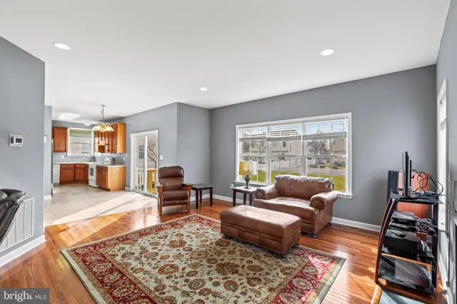 a living room with furniture and a rug