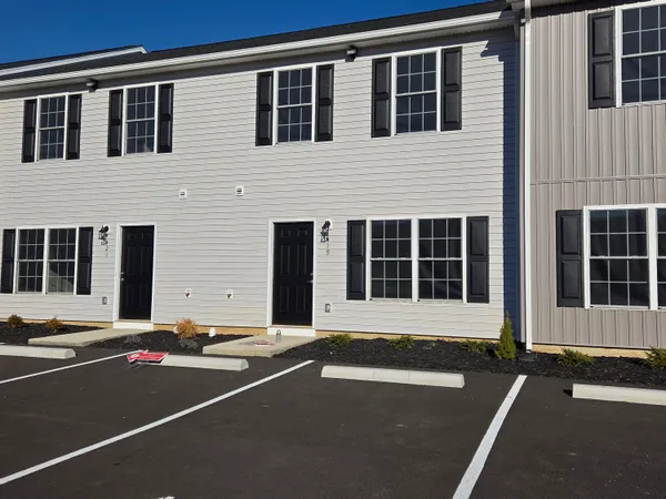 a front view of a building with a street