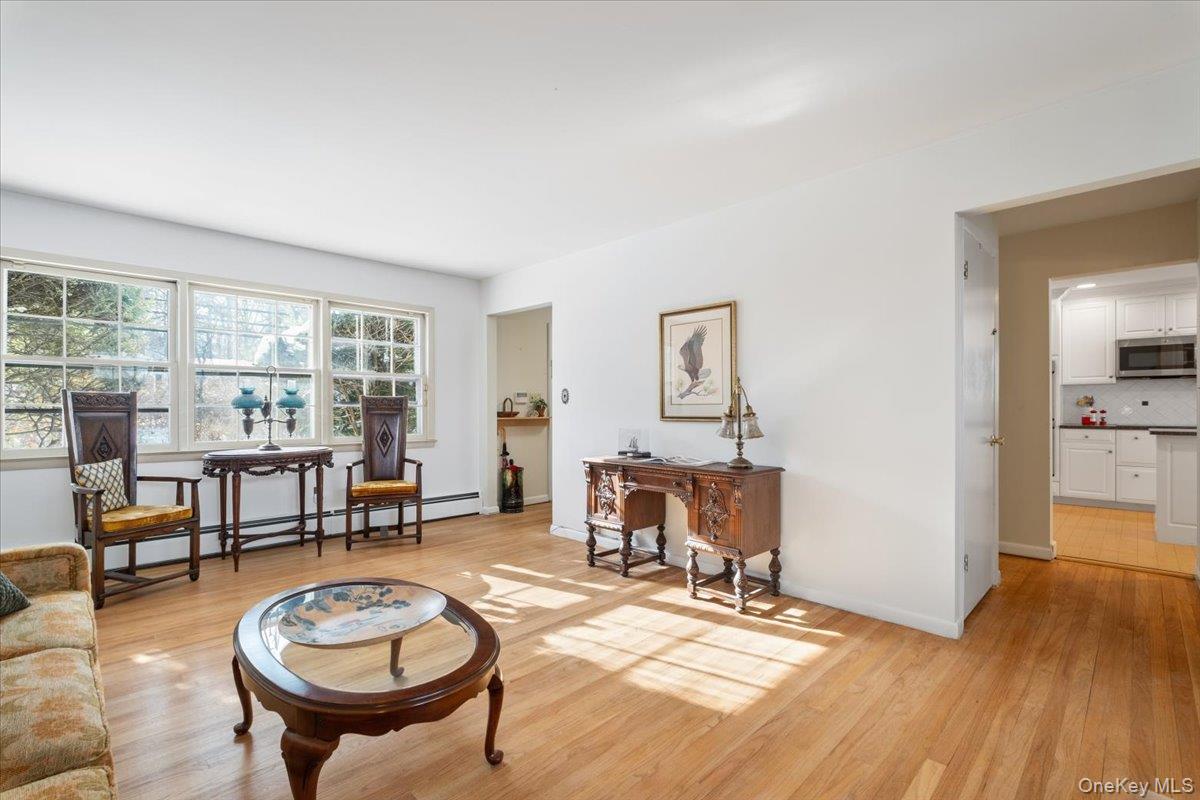 496 Granite Springs Road Yorktown Heights, NY 10598 - Photo 11 of 43 a living room with furniture a table and a large window