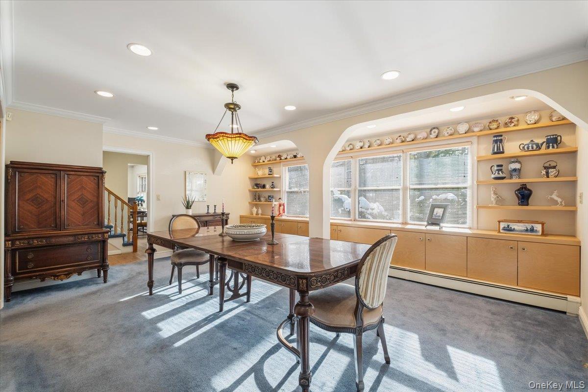 496 Granite Springs Road Yorktown Heights, NY 10598 - Photo 15 of 43 a view of a dining room with furniture and chandelier