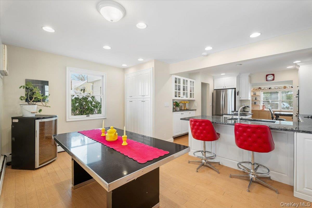 496 Granite Springs Road Yorktown Heights, NY 10598 - Photo 20 of 43 a room with table chairs and kitchen view