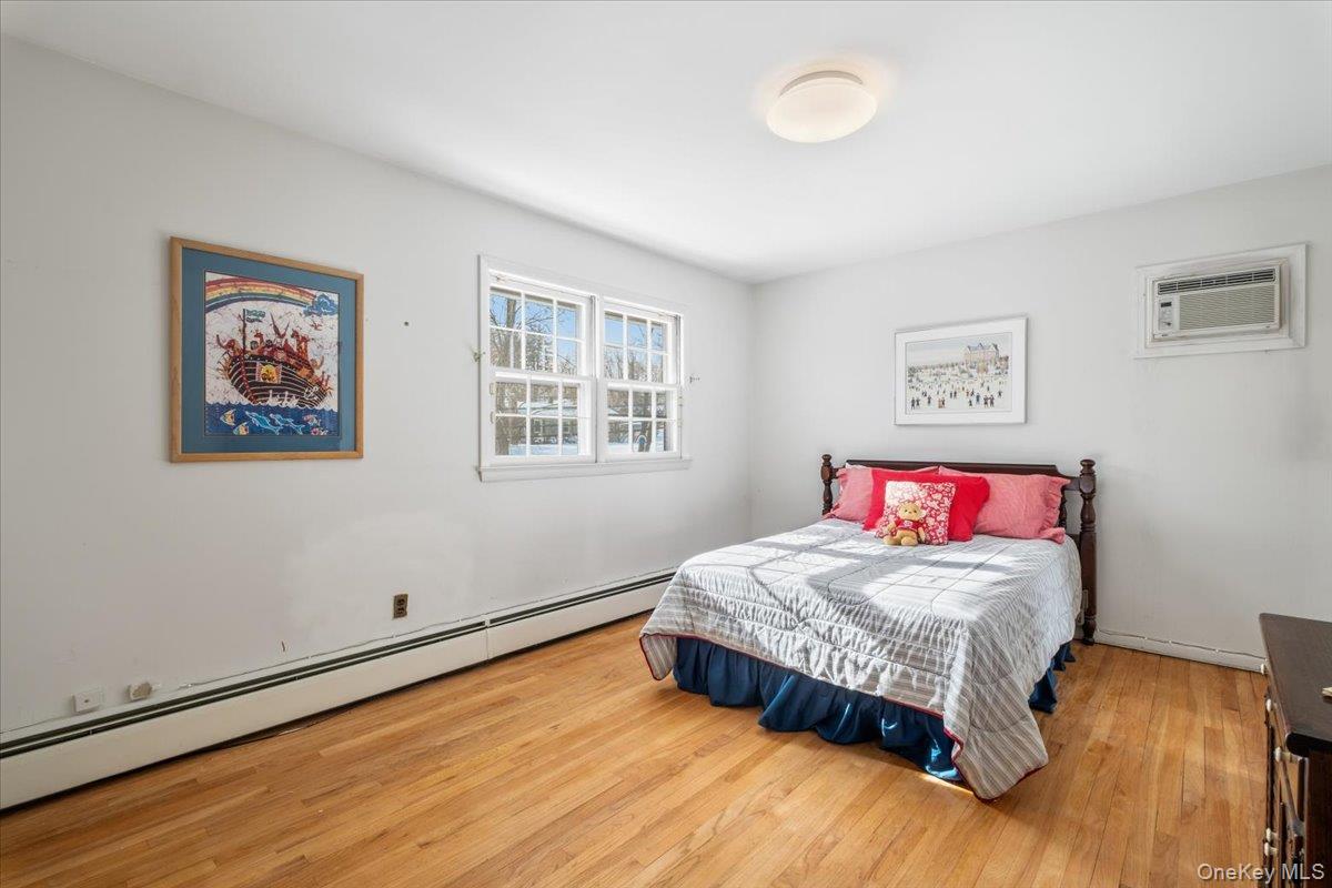 496 Granite Springs Road Yorktown Heights, NY 10598 - Photo 23 of 43 a bedroom with a bed and a dresser next to a window