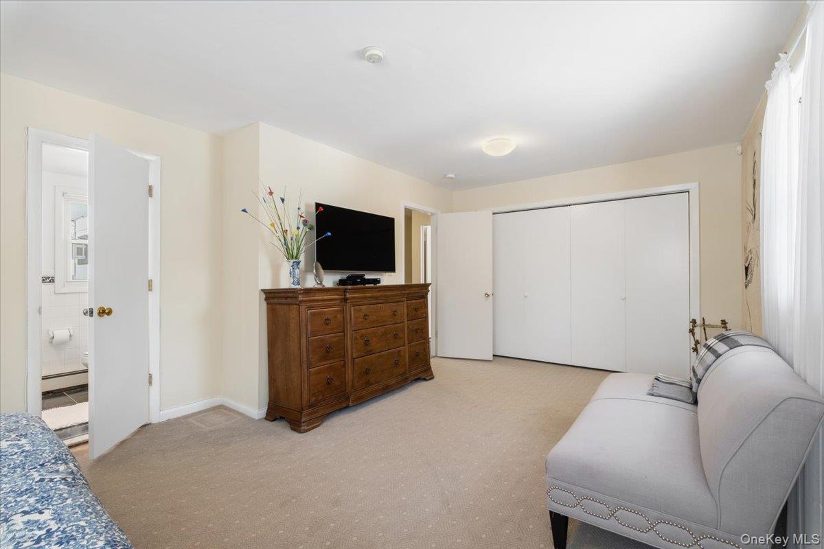496 Granite Springs Road Yorktown Heights, NY 10598 - Photo 25 of 43 a living room with furniture and a flat screen tv