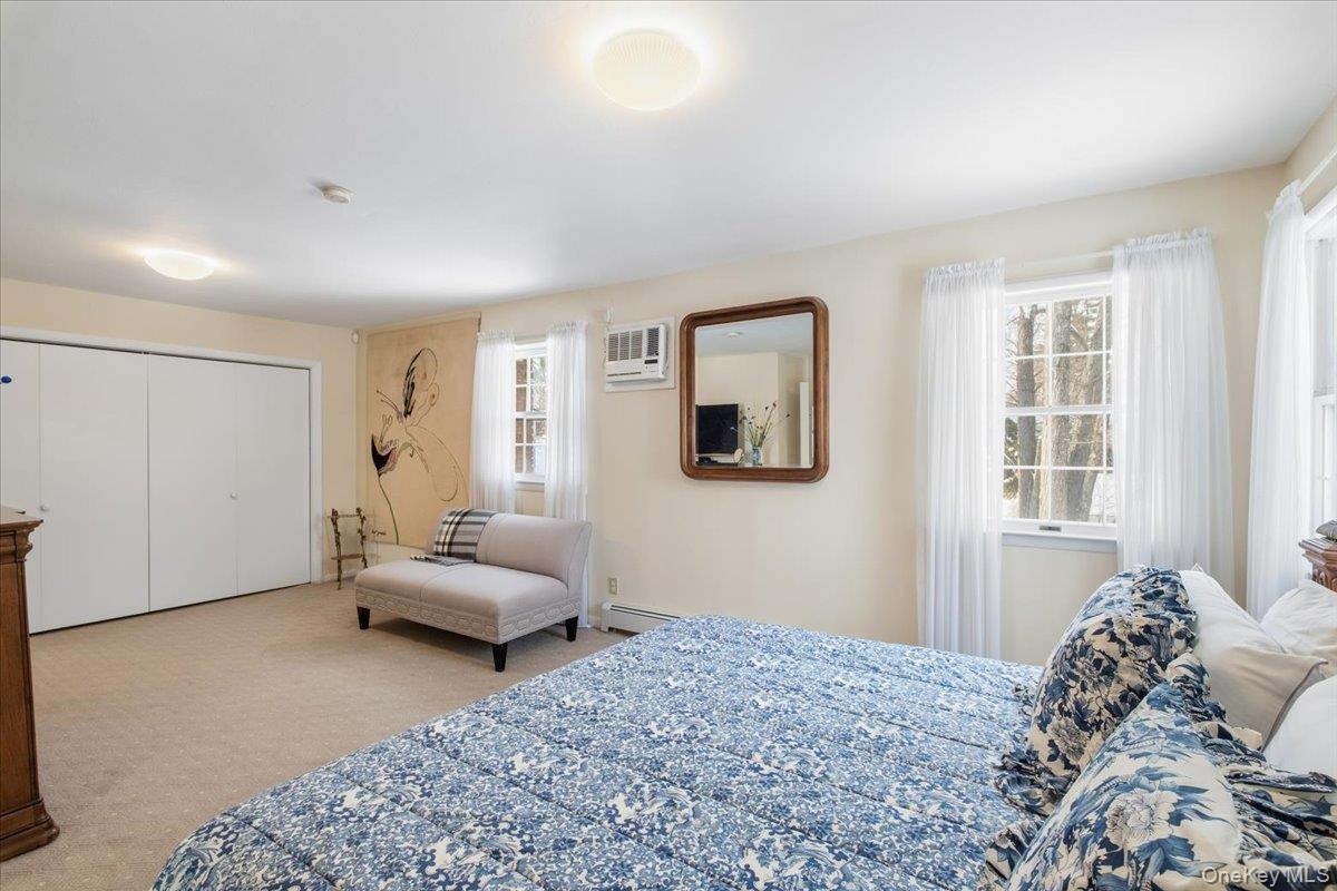 496 Granite Springs Road Yorktown Heights, NY 10598 - Photo 26 of 43 a bedroom with a bed and wooden floor