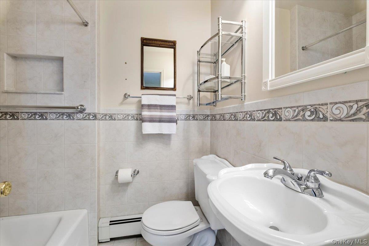 496 Granite Springs Road Yorktown Heights, NY 10598 - Photo 28 of 43 a bathroom with a sink a toilet and shower