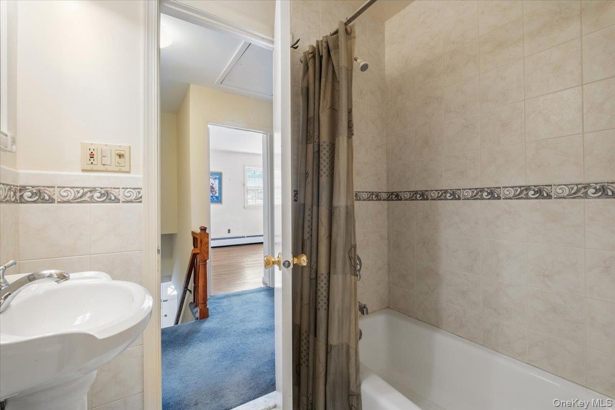 496 Granite Springs Road Yorktown Heights, NY 10598 - Photo 29 of 43 a bathroom with a sink toilet and shower