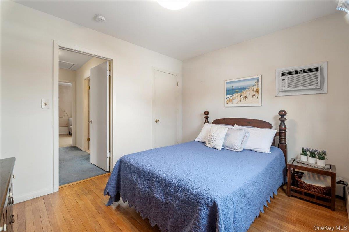 496 Granite Springs Road Yorktown Heights, NY 10598 - Photo 30 of 43 a bedroom with a bed and wooden floor