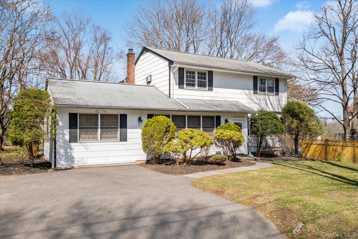 496 Granite Springs Road Yorktown Heights, NY 10598 - Photo 3 of 43 a front view of a house with a yard and glass windows